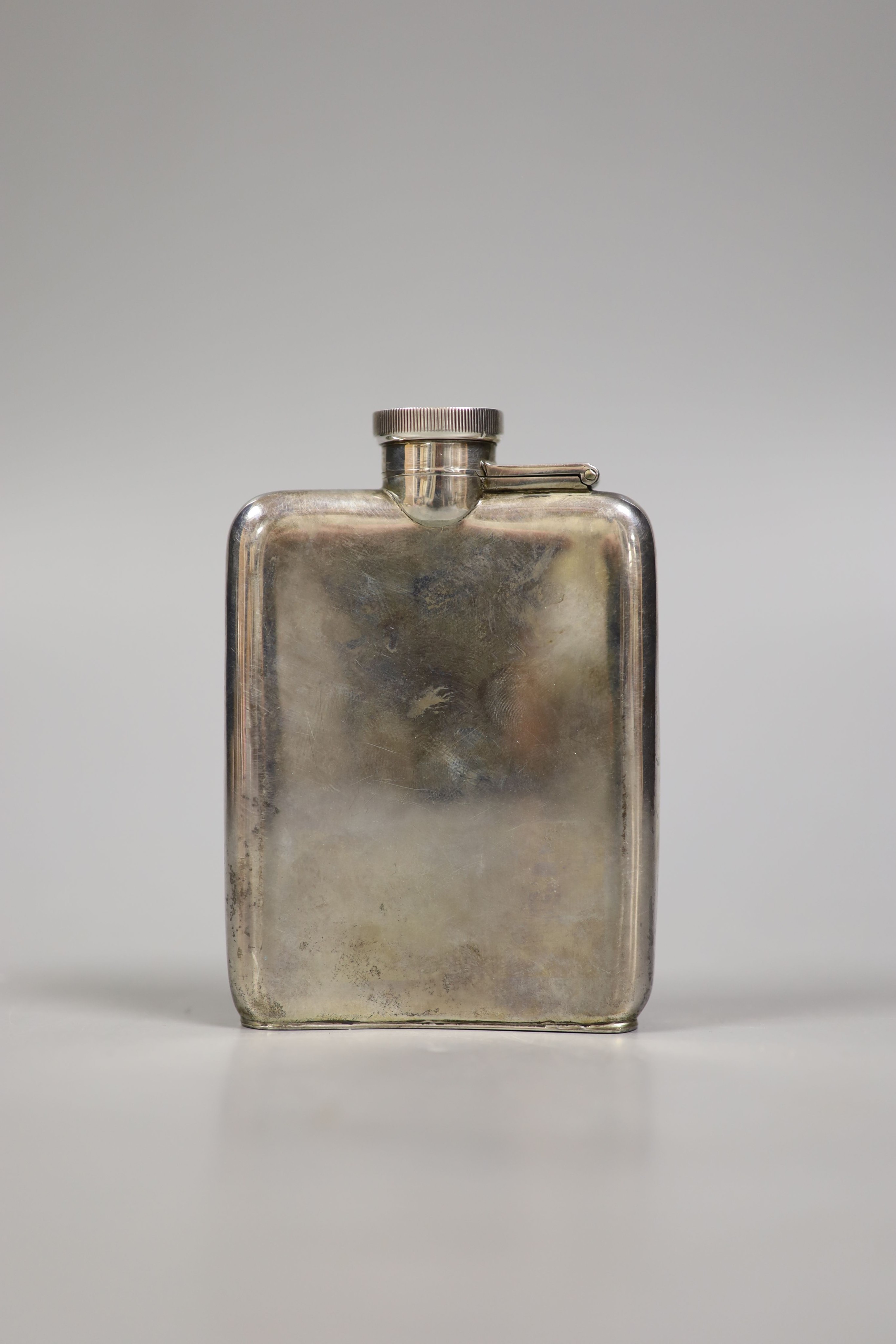 A George V silver hip flask, Birmingham, 1915, 10.1cm, 117 grams.